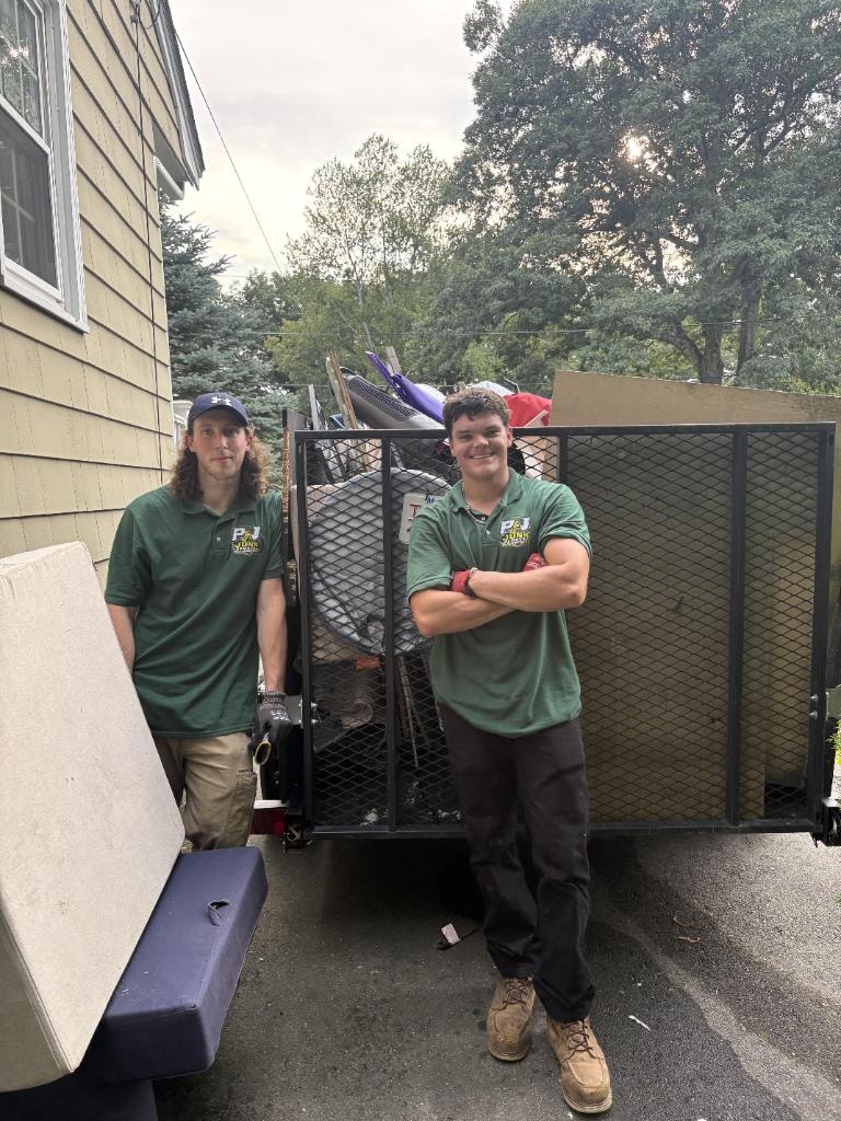 Patrick and Joey in P&J branded polos with loaded trailer